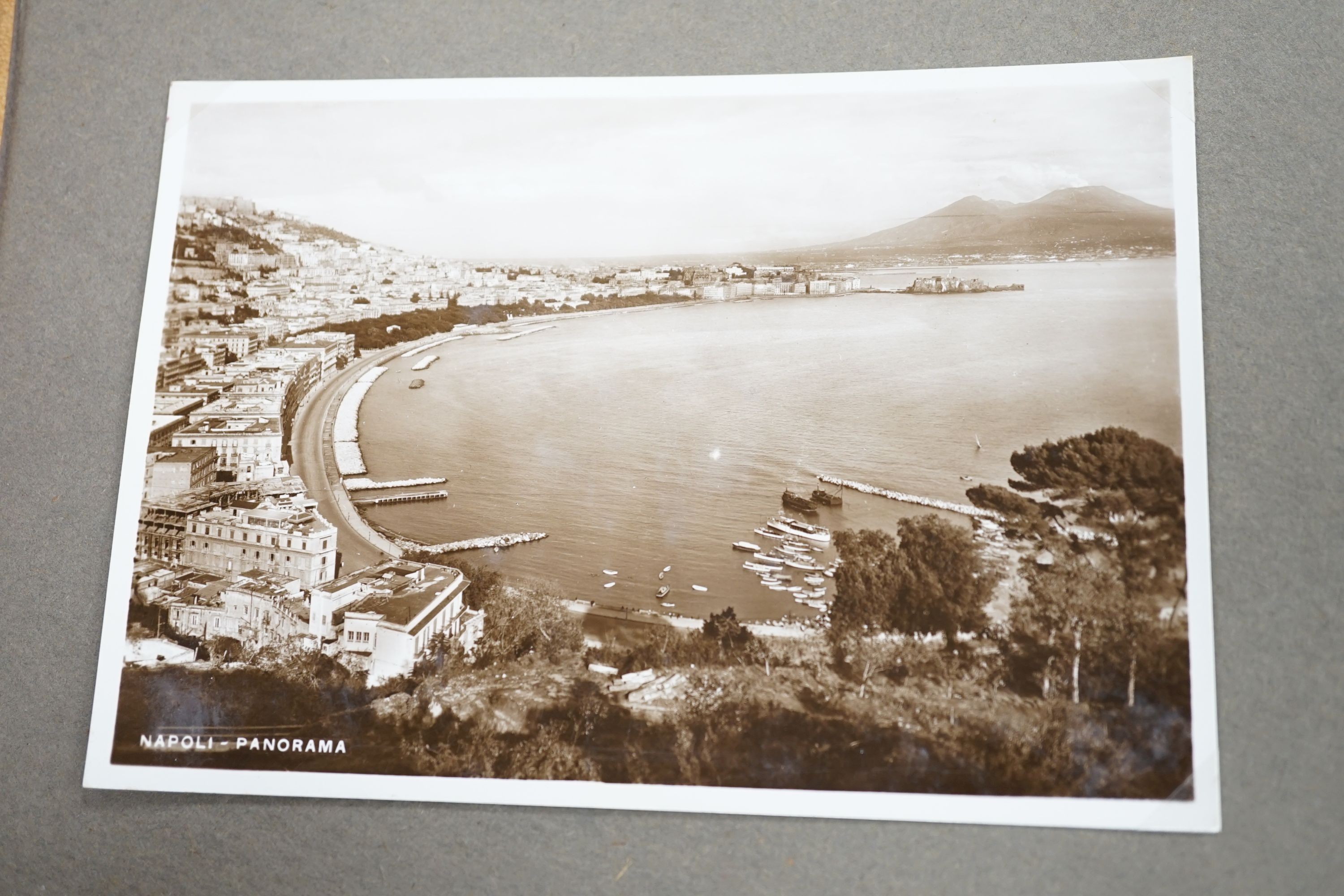 A collection of postcards, a photo album and an album of silks